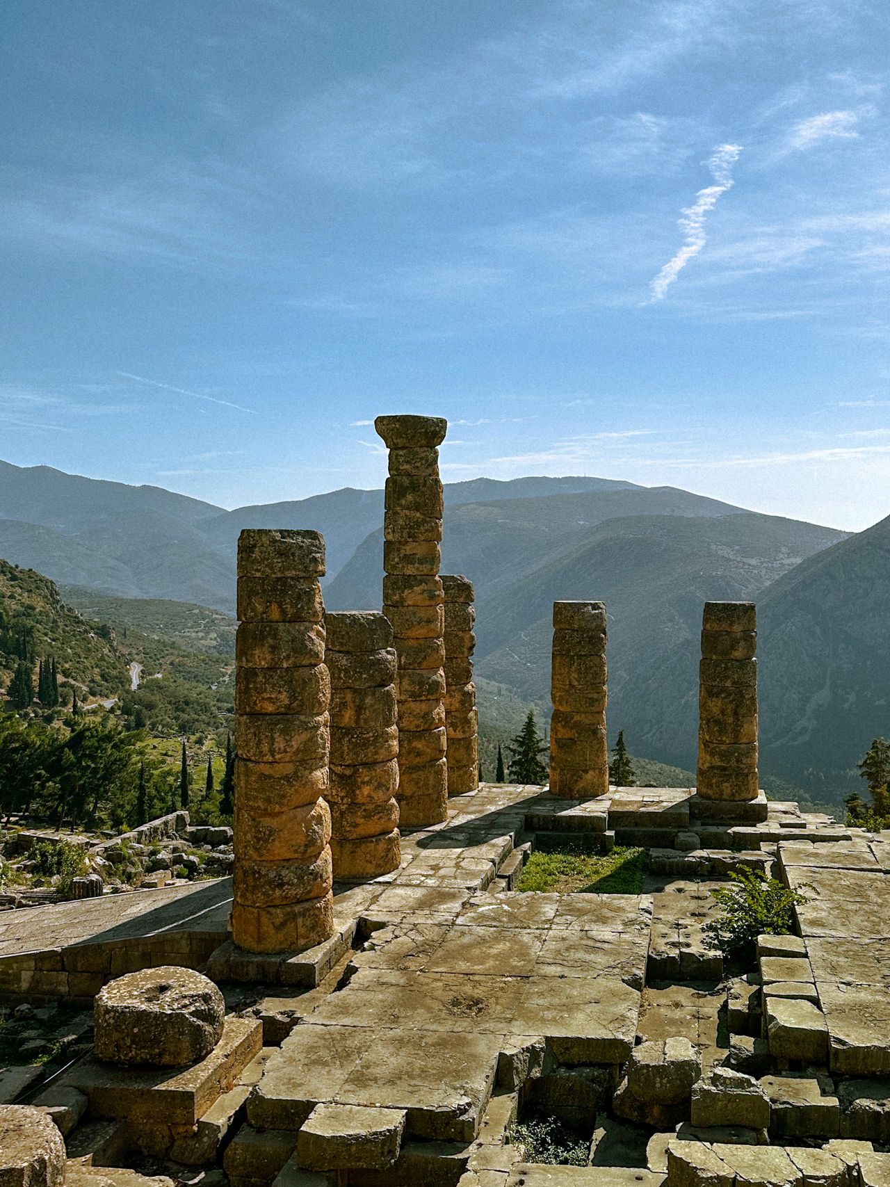 Delphi archaeological site Temple of Apollo ruins on mountainside